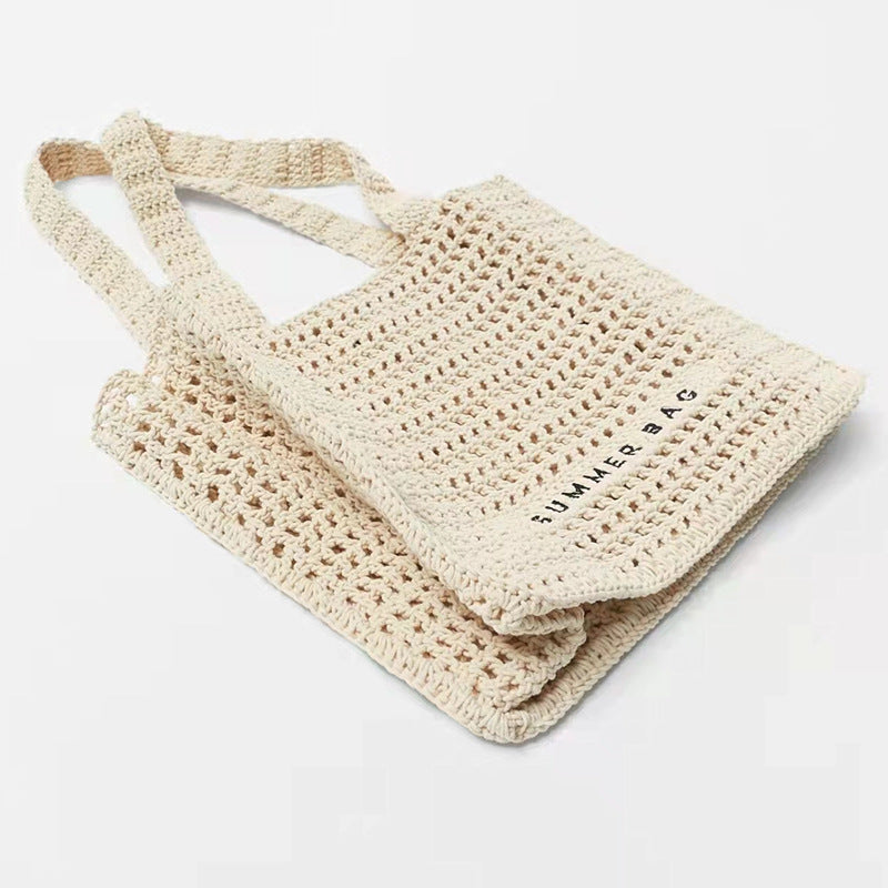 Bolso de mano de paja de crochet hueco para verano junto al mar