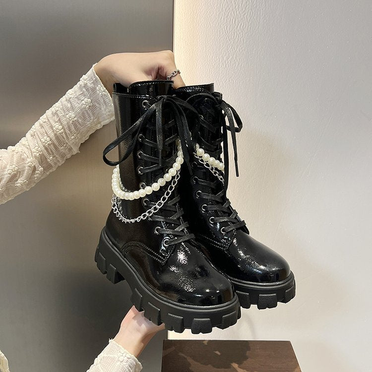 Pero las botas Doc Martens con cordones hasta la rodilla para niñas