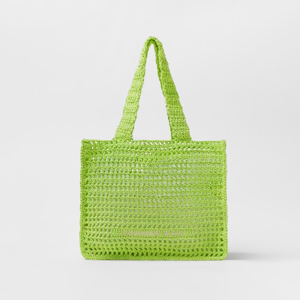 Bolso de mano de paja de crochet hueco para verano junto al mar