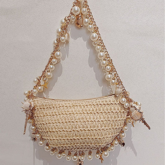 Bolso de paja con forma de caracol y perlas para vacaciones en la playa en verano