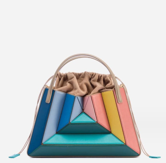 Bolso de mano con diseño de patchwork en contraste de colores y un diseño especial para llevar debajo del brazo con cordón para mujer